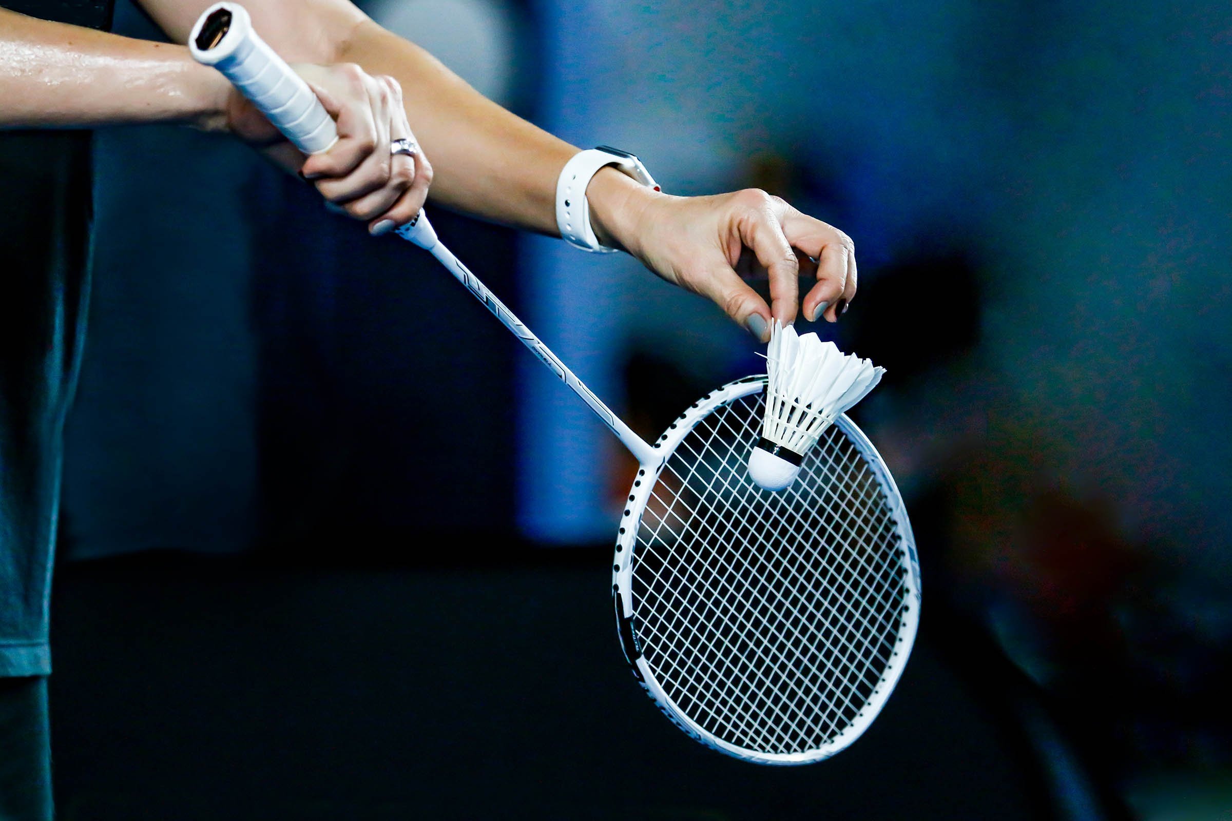 Badminton player serving