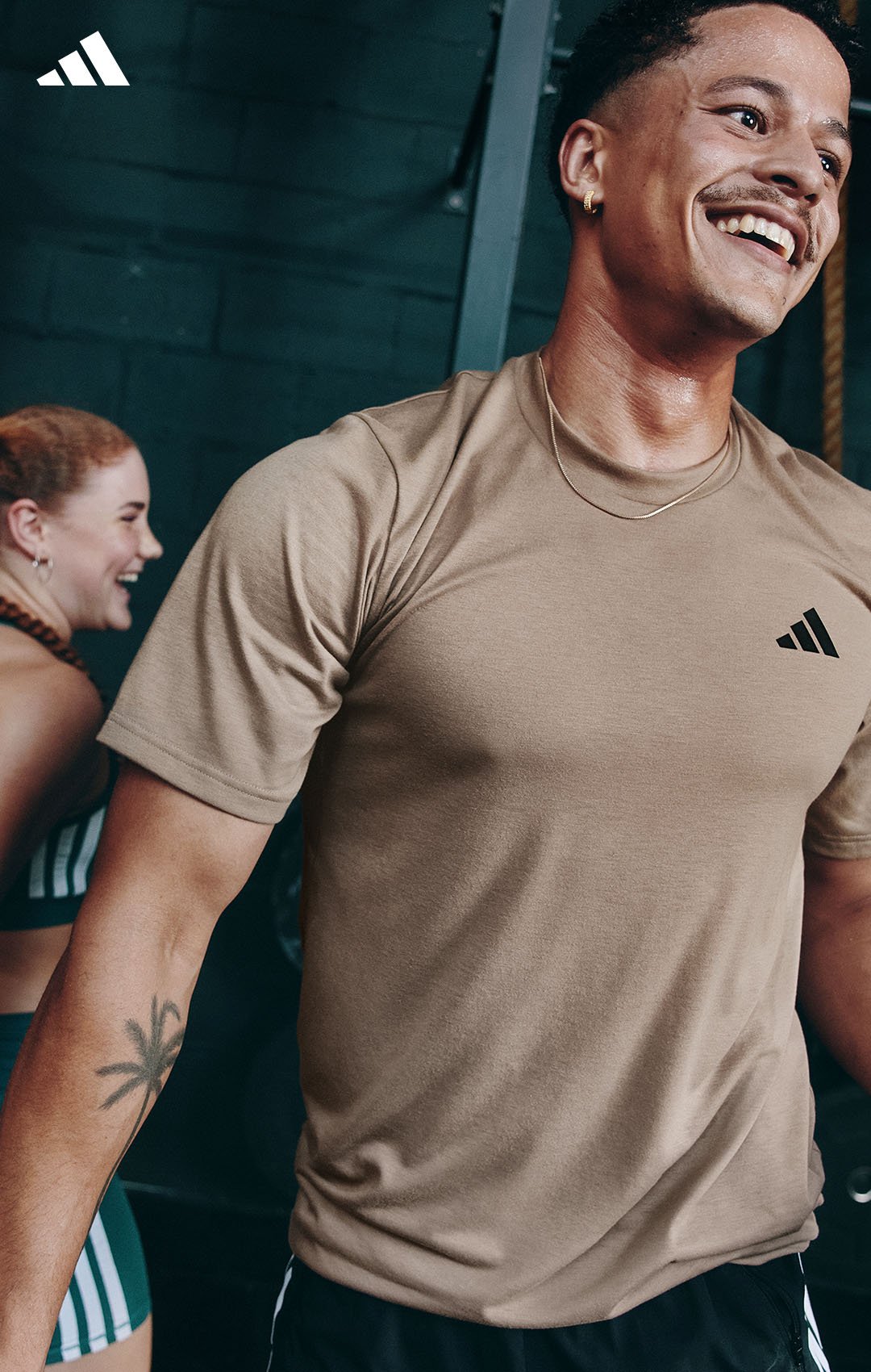 male in gym laughing