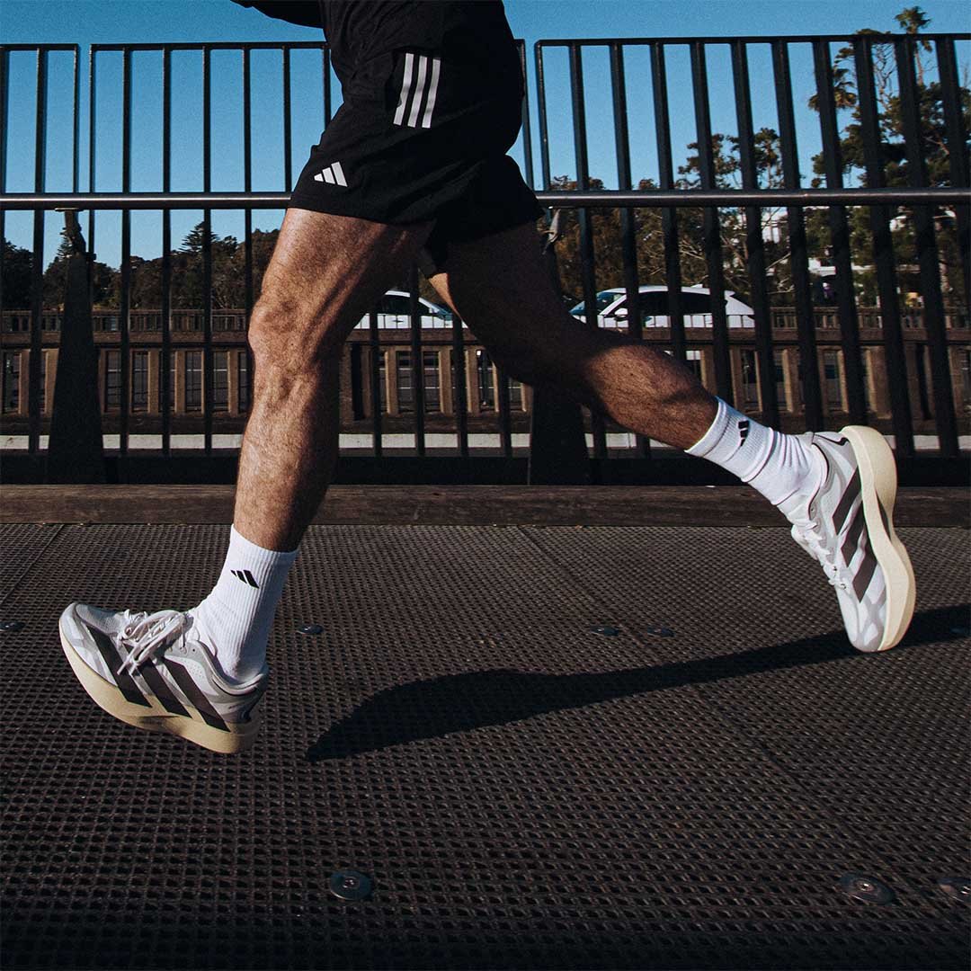 Male running across Bridge